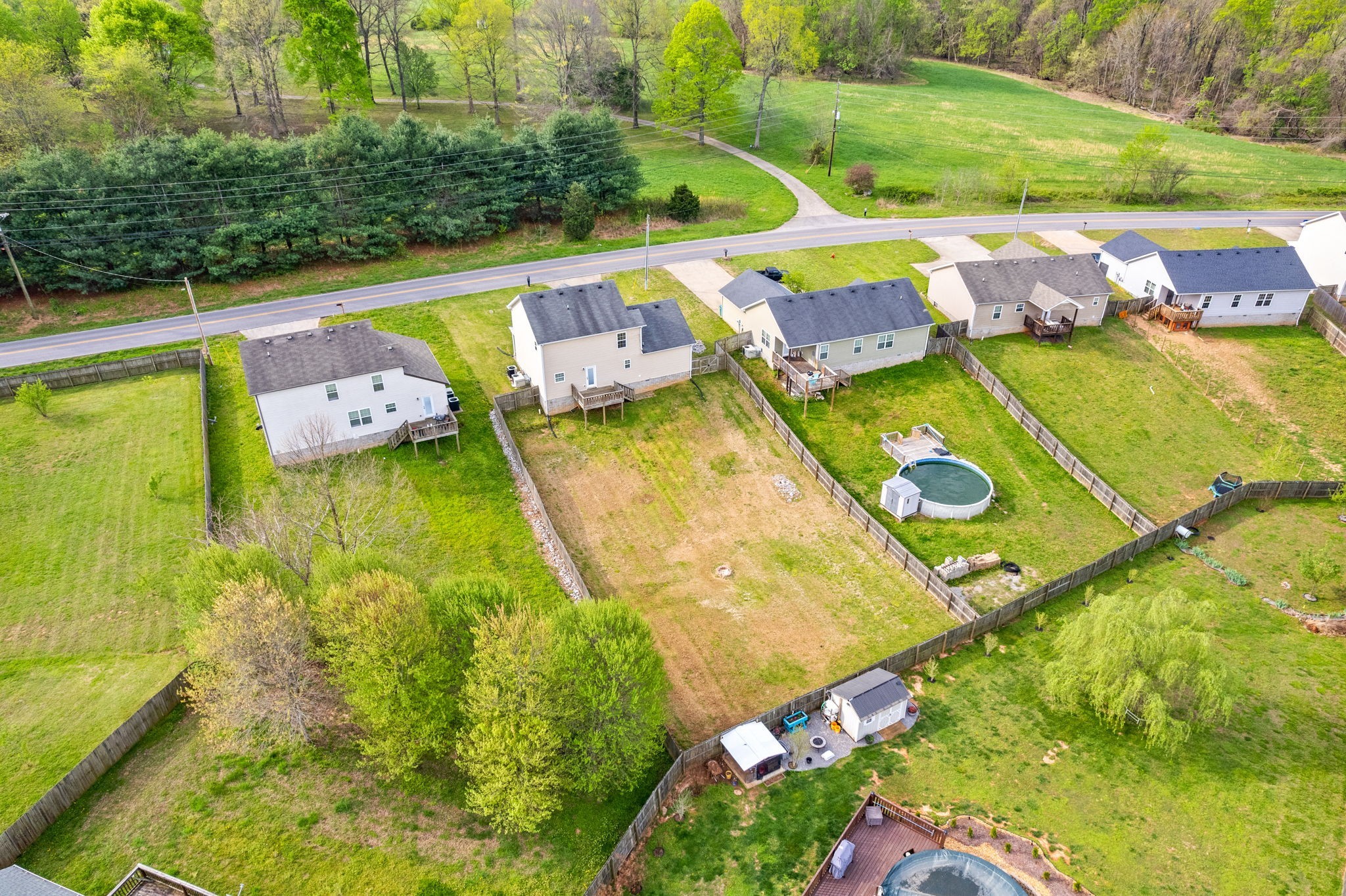 1563 Hazelwood Road Clarksville, TN 37042 - Photo 42 of 43 an aerial view of a swimming pool with a yard