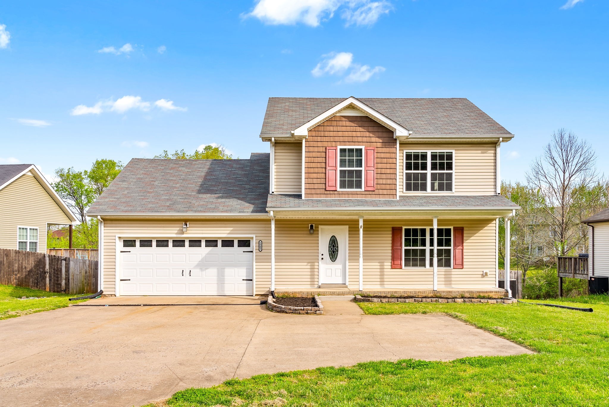 1563 Hazelwood Road Clarksville, TN 37042 - Photo 5 of 43 a front view of a house with a yard and garage