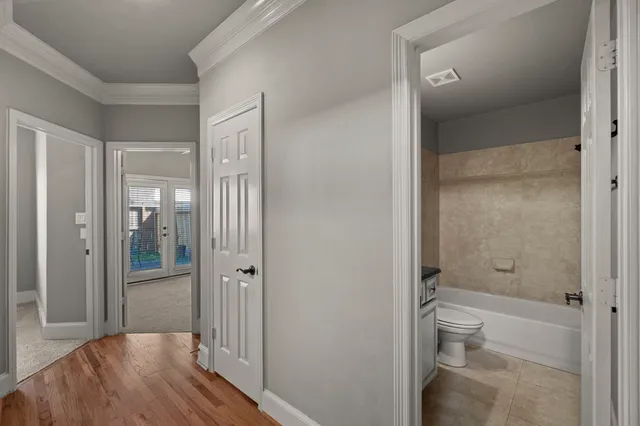 a bathroom with a granite countertop toilet a sink and shower