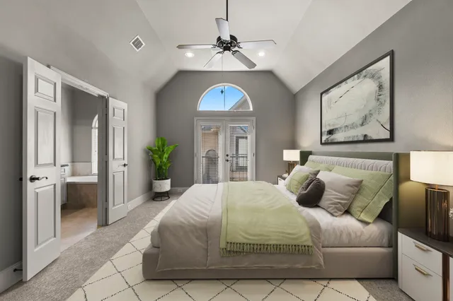 a bedroom with a bed and a chandelier