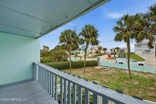 a view of swimming pool from a balcony