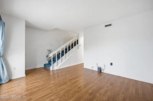 a view of entryway with wooden floor