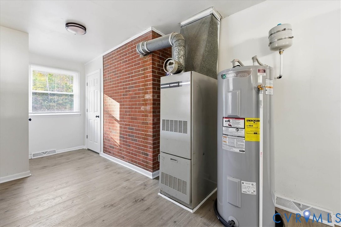 6413 Bull Hill Road Prince George, VA 23875 - Photo 14 of 27 Utility room featuring electric water heater and h