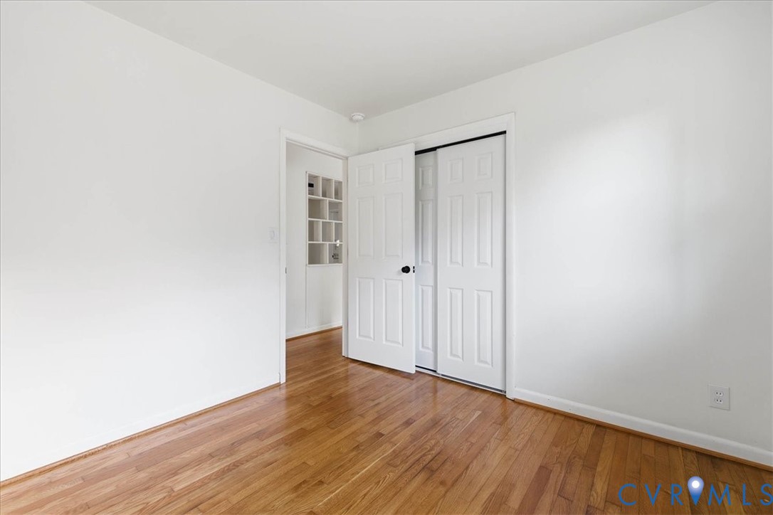 6413 Bull Hill Road Prince George, VA 23875 - Photo 16 of 27 Unfurnished bedroom with light wood-style floors a