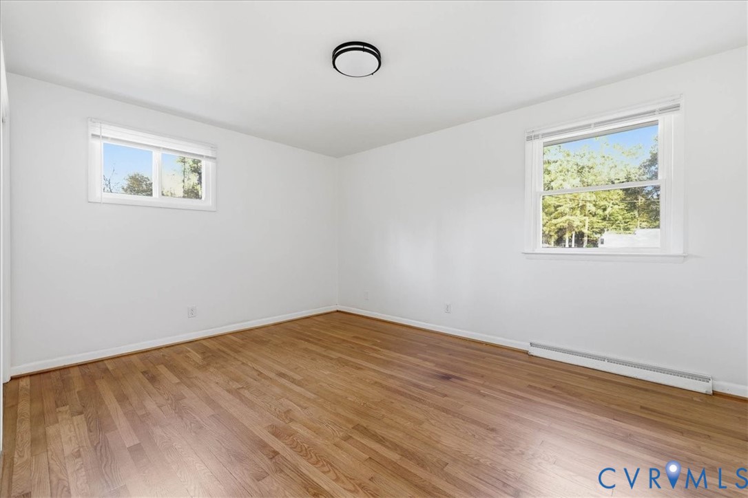 6413 Bull Hill Road Prince George, VA 23875 - Photo 19 of 27 Empty room featuring light wood-style floors