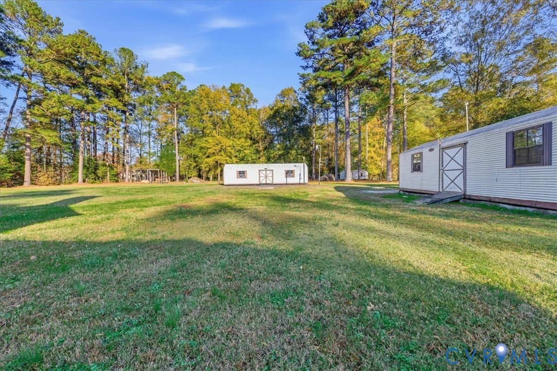 6413 Bull Hill Road Prince George, VA 23875 - Photo 25 of 27 View of grassy yard with an outdoor structure