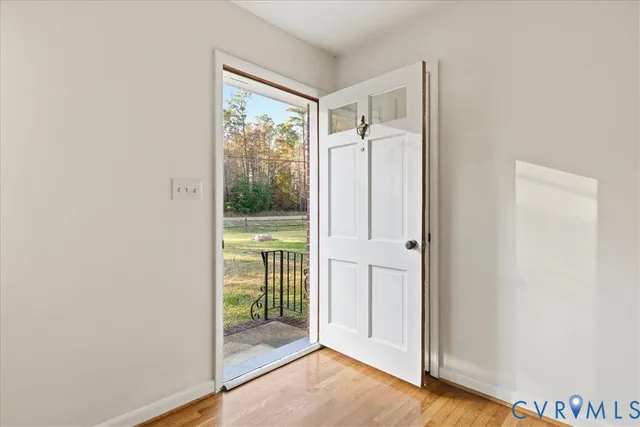 a view of entryway with wooden floor