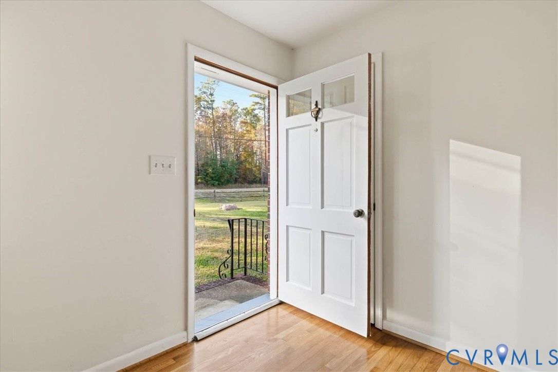 6413 Bull Hill Road Prince George, VA 23875 - Photo 4 of 27 Doorway to outside with wood finished floors and b