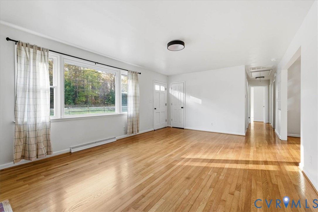 6413 Bull Hill Road Prince George, VA 23875 - Photo 7 of 27 Unfurnished living room with a baseboard radiator,