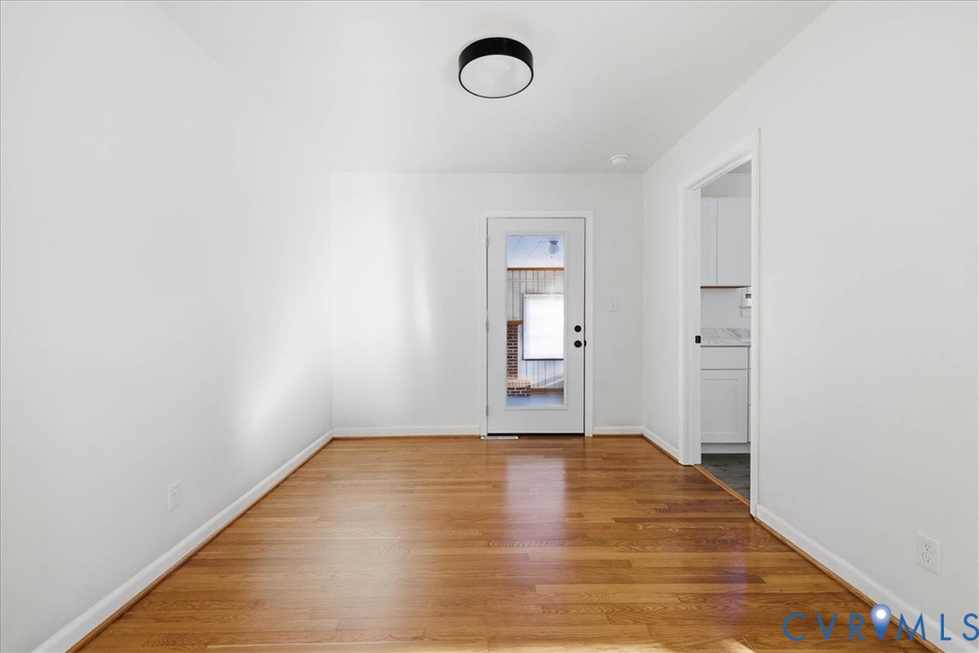 6413 Bull Hill Road Prince George, VA 23875 - Photo 8 of 27 Empty room featuring light wood-style floors and b