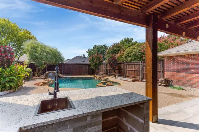 a wooden bench sitting in front of a building