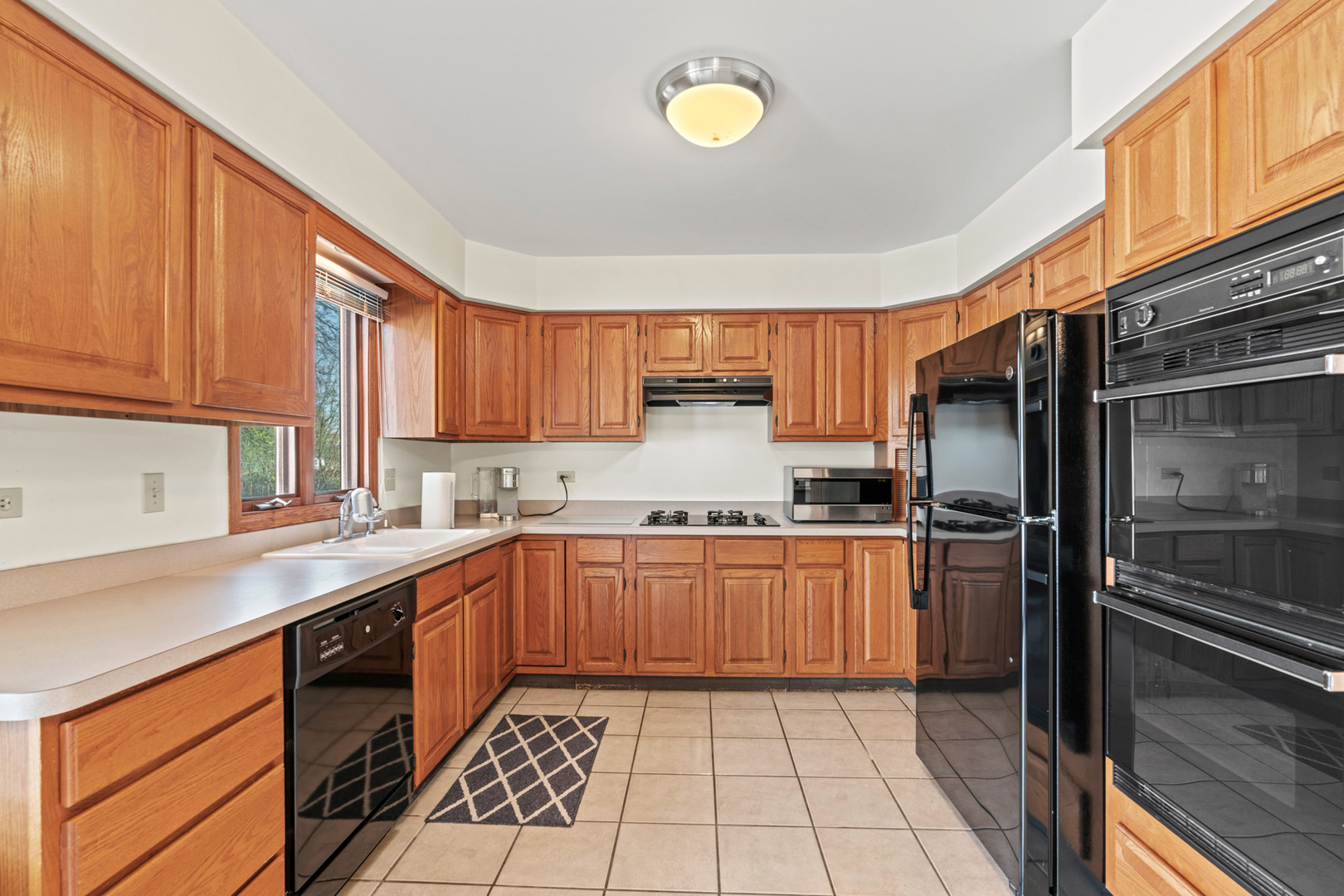 2344 Forest Avenue Rolling Meadows, IL 60008 - Photo 12 of 29 a kitchen with stainless steel appliances granite countertop a refrigerator and a sink