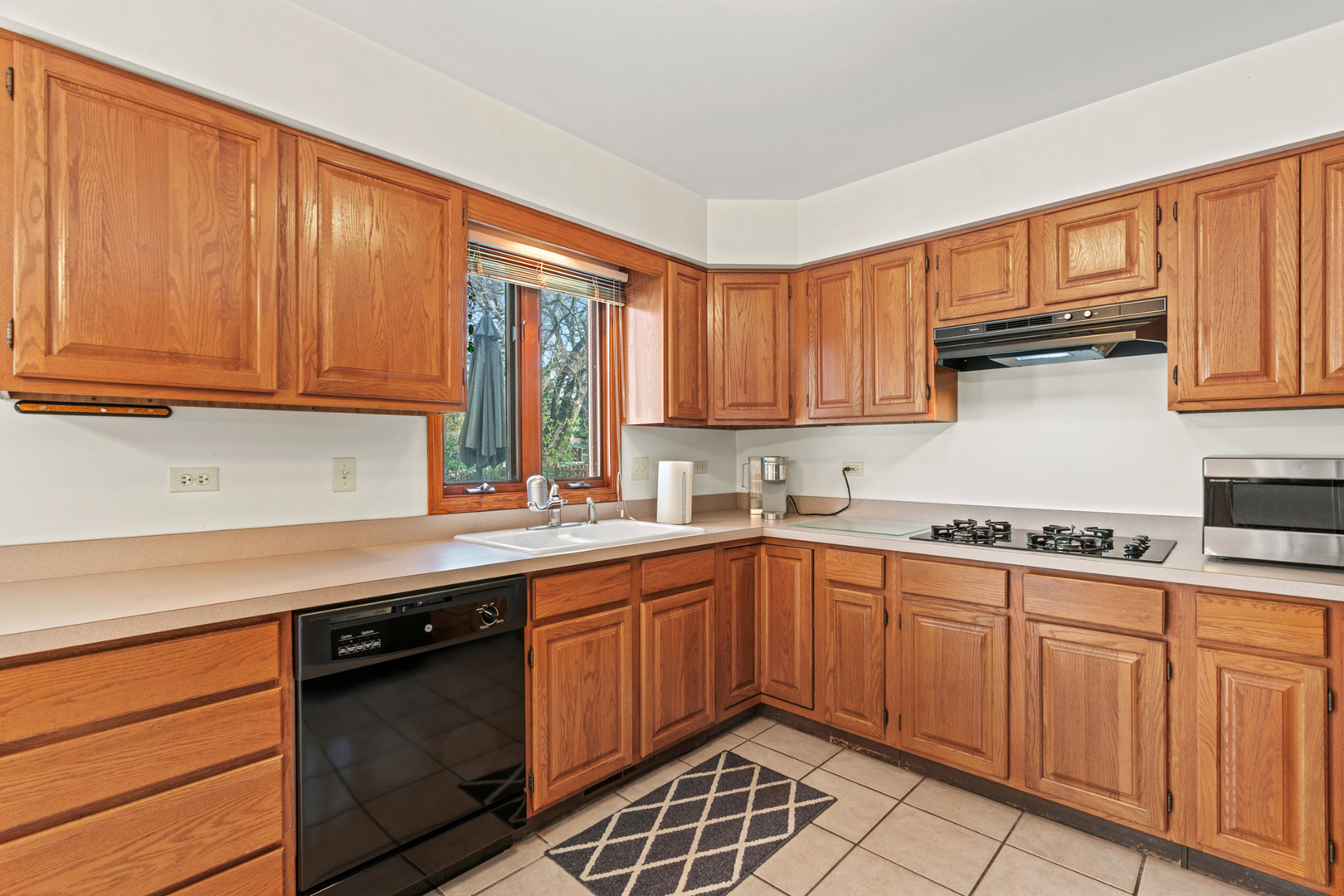 2344 Forest Avenue Rolling Meadows, IL 60008 - Photo 14 of 29 a kitchen with a sink stove and cabinets