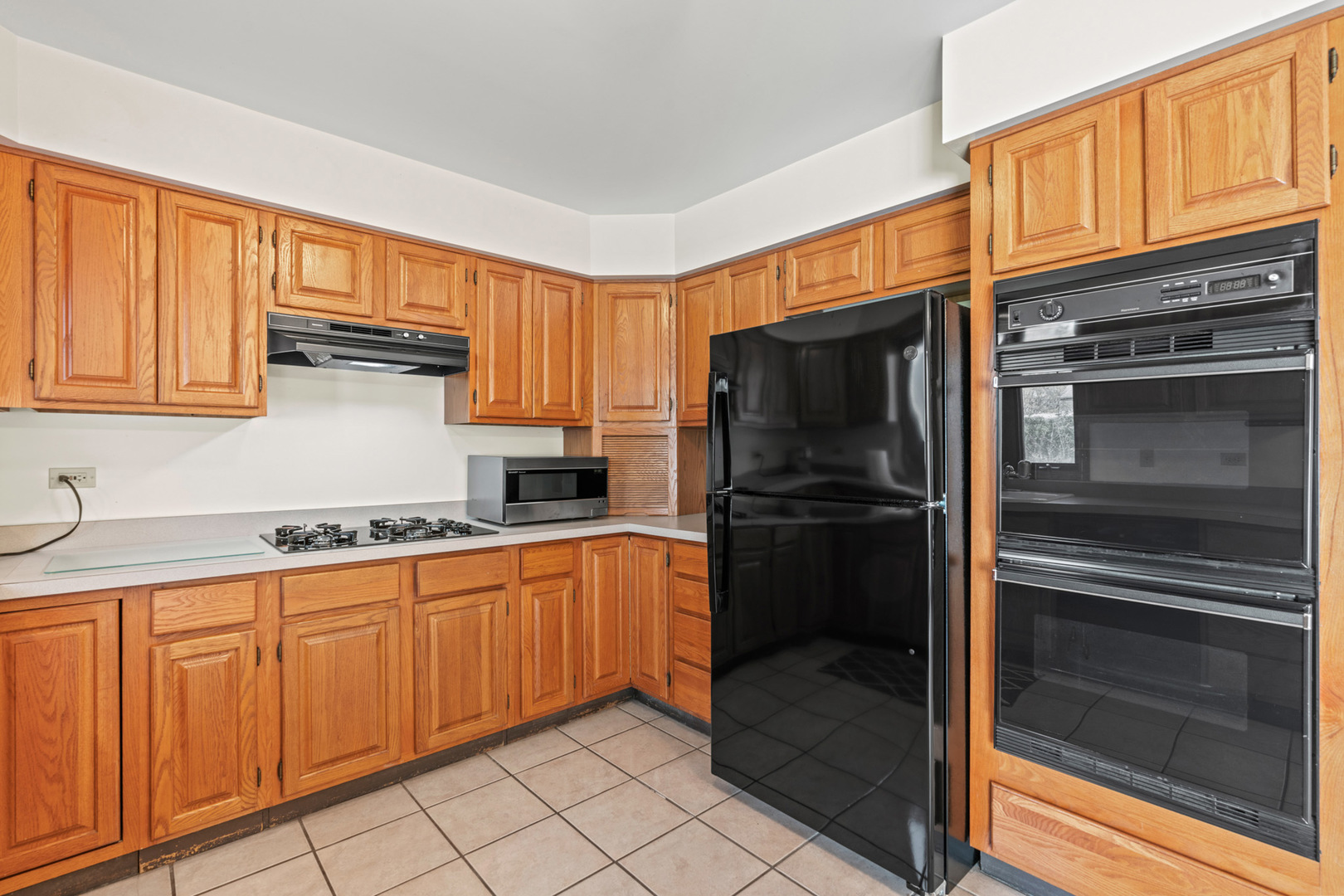 2344 Forest Avenue Rolling Meadows, IL 60008 - Photo 15 of 29 a kitchen with granite countertop stainless steel appliances and wooden cabinets