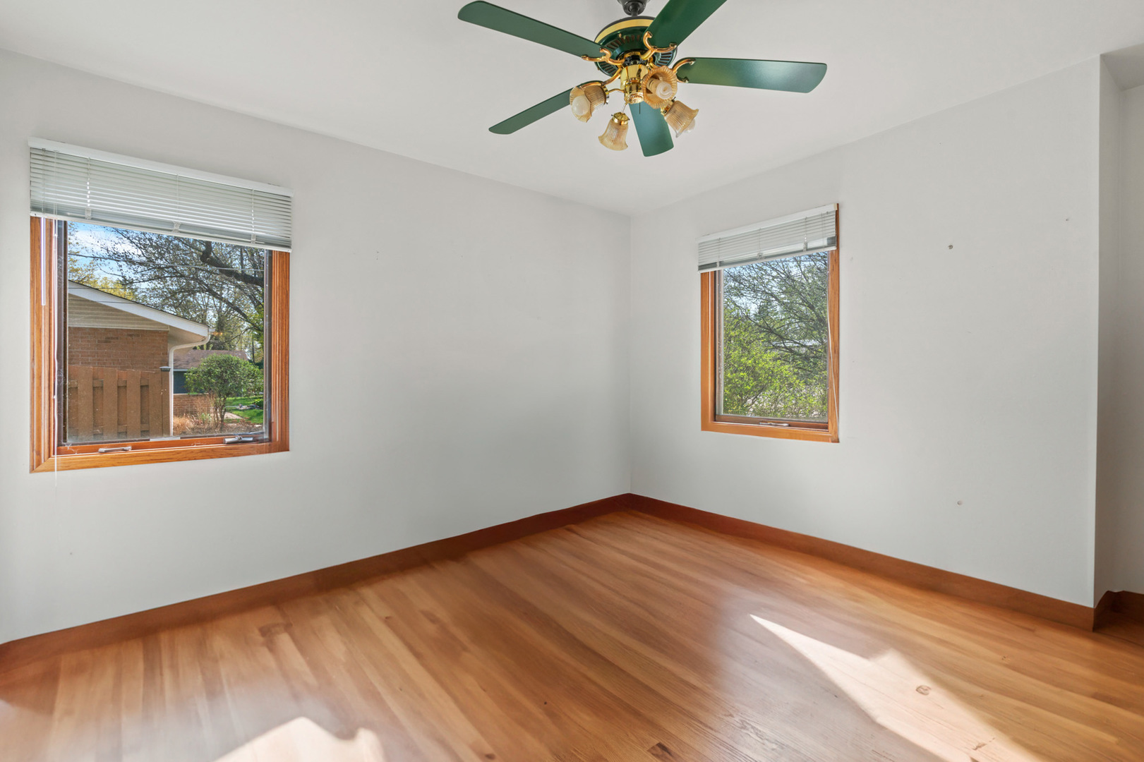 2344 Forest Avenue Rolling Meadows, IL 60008 - Photo 5 of 29 a view of an empty room with window and wooden floor