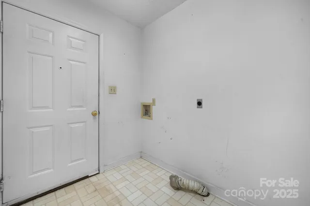 a view of a room with wooden walls