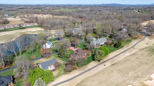 a view of a swimming pool with a yard