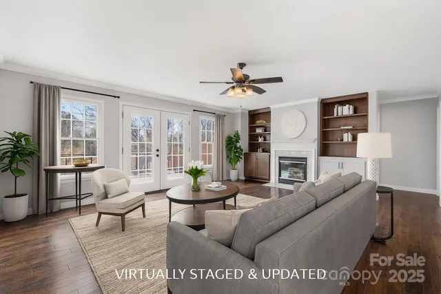 a kitchen with stainless steel appliances a stove a sink cabinets and a refrigerator