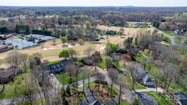 an aerial view of residential house and green space