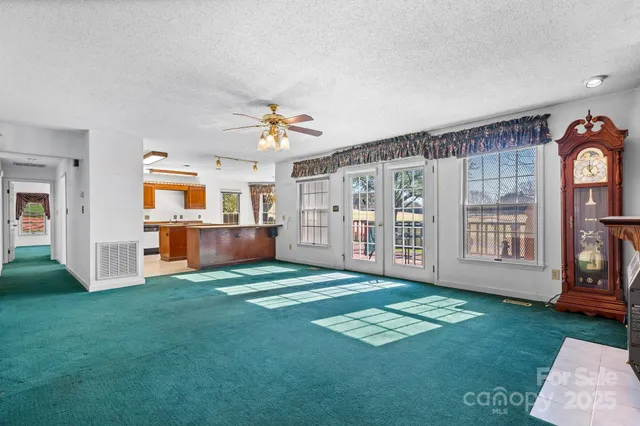 a kitchen with stainless steel appliances granite countertop a stove and a refrigerator
