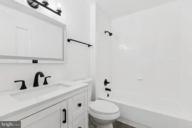 a view of a backyard with wooden fence