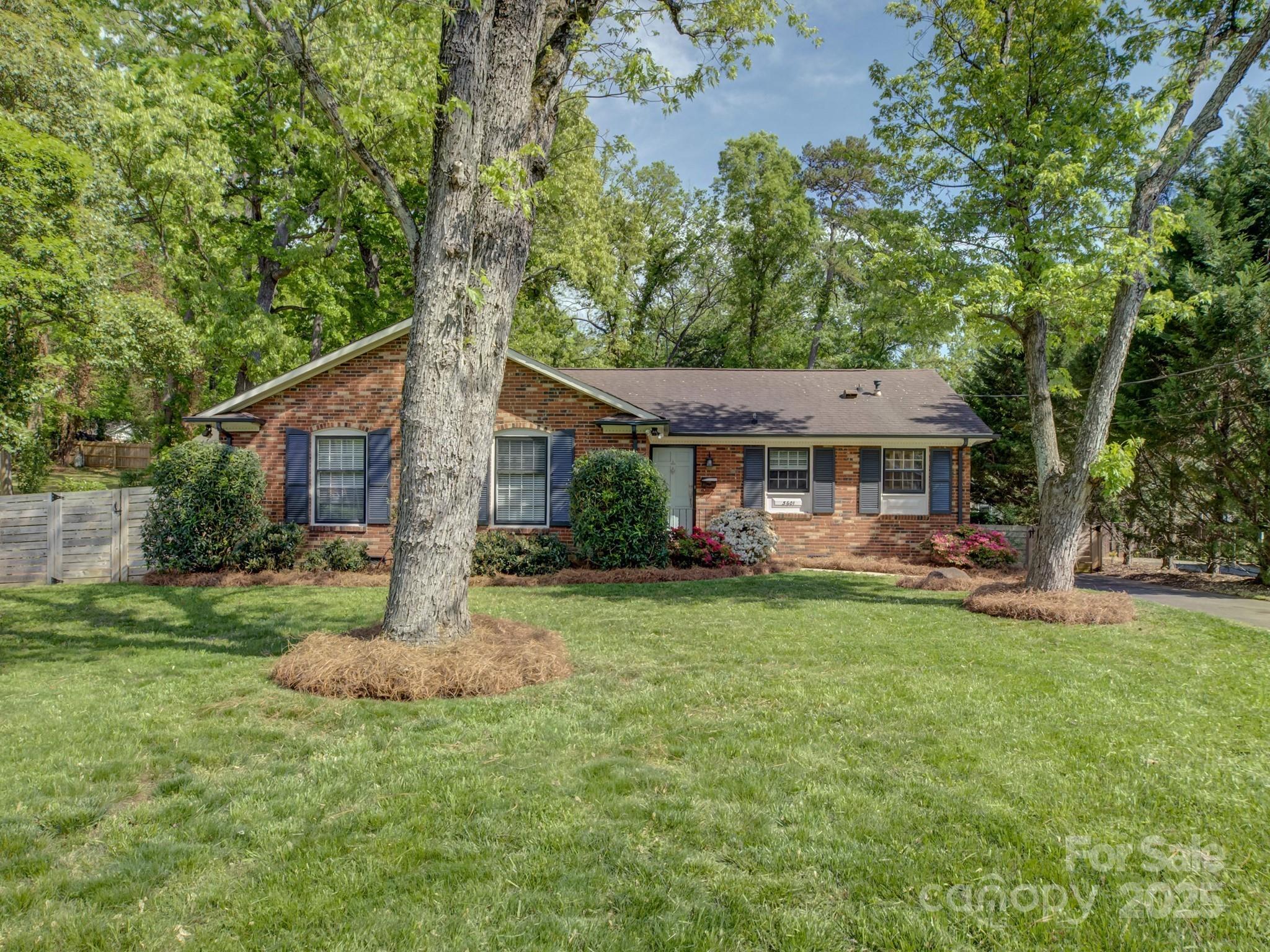 5601 Londonderry Road Charlotte, NC 28210 - Photo 1 of 42 a view of a house with a yard and sitting area