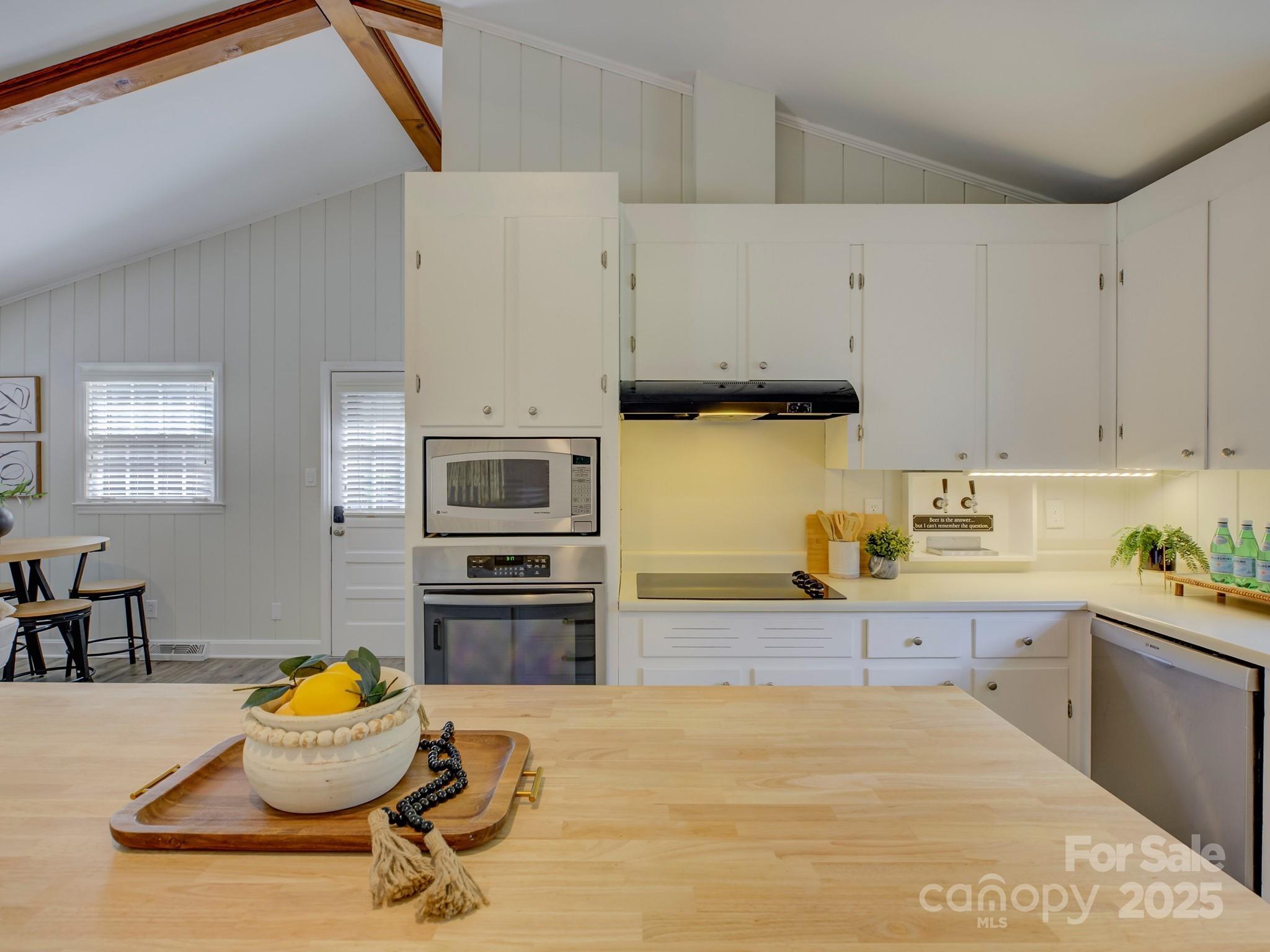 5601 Londonderry Road Charlotte, NC 28210 - Photo 16 of 42 a kitchen with a sink and a stove top oven