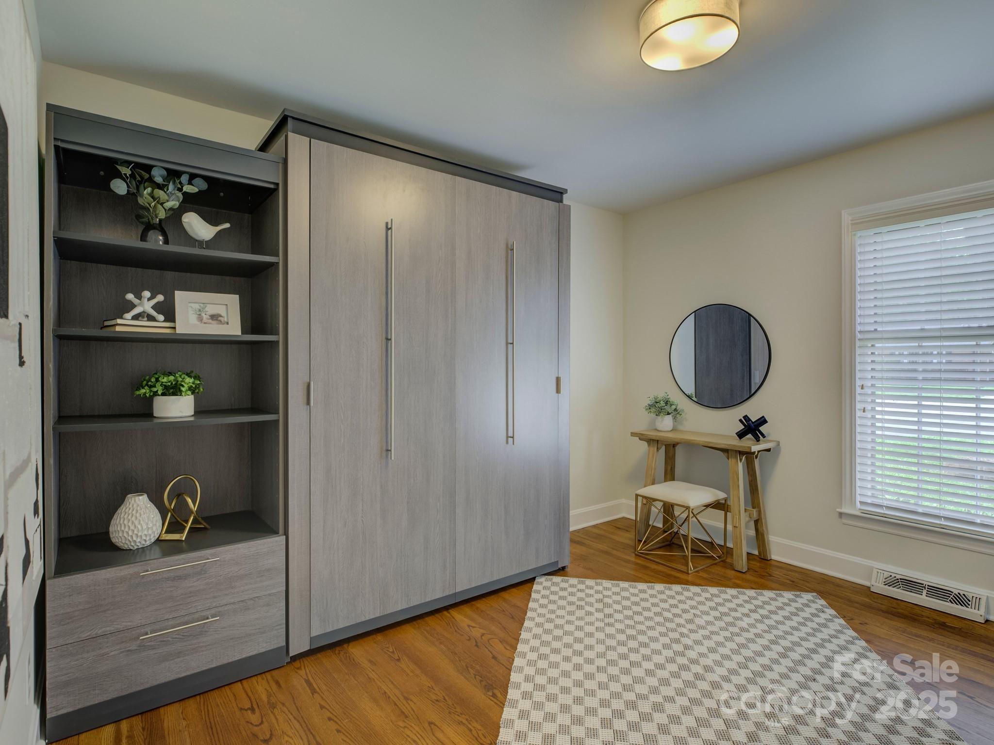 5601 Londonderry Road Charlotte, NC 28210 - Photo 19 of 42 a room with wooden floor and furniture