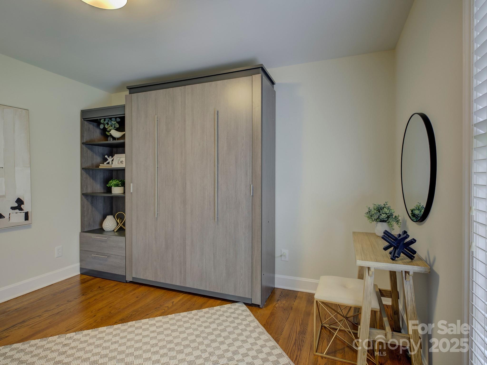 5601 Londonderry Road Charlotte, NC 28210 - Photo 21 of 42 a view of a room with wooden floor and cabinet