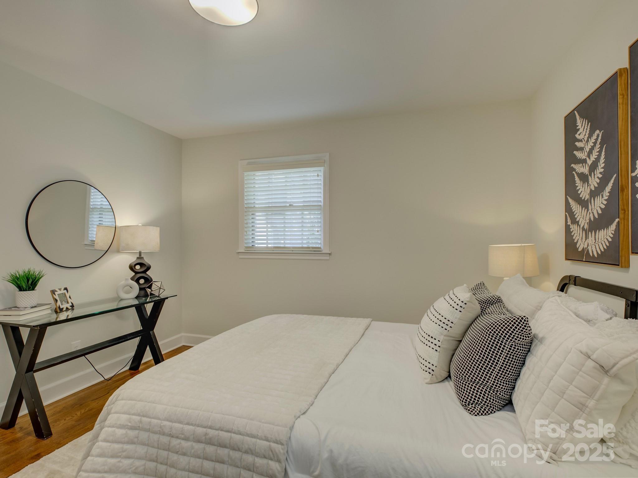 5601 Londonderry Road Charlotte, NC 28210 - Photo 27 of 42 a bedroom with bed and a window