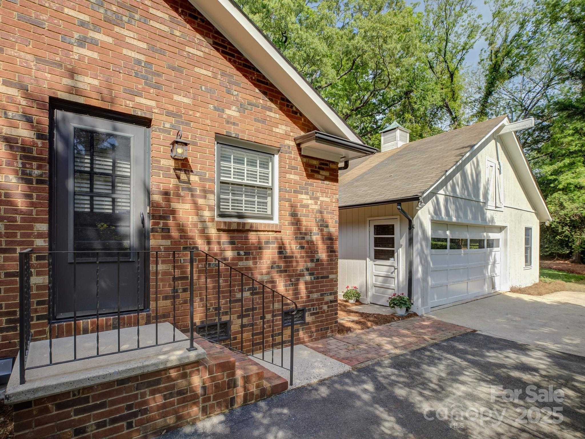 5601 Londonderry Road Charlotte, NC 28210 - Photo 30 of 42 a view of a house with a garage and balcony