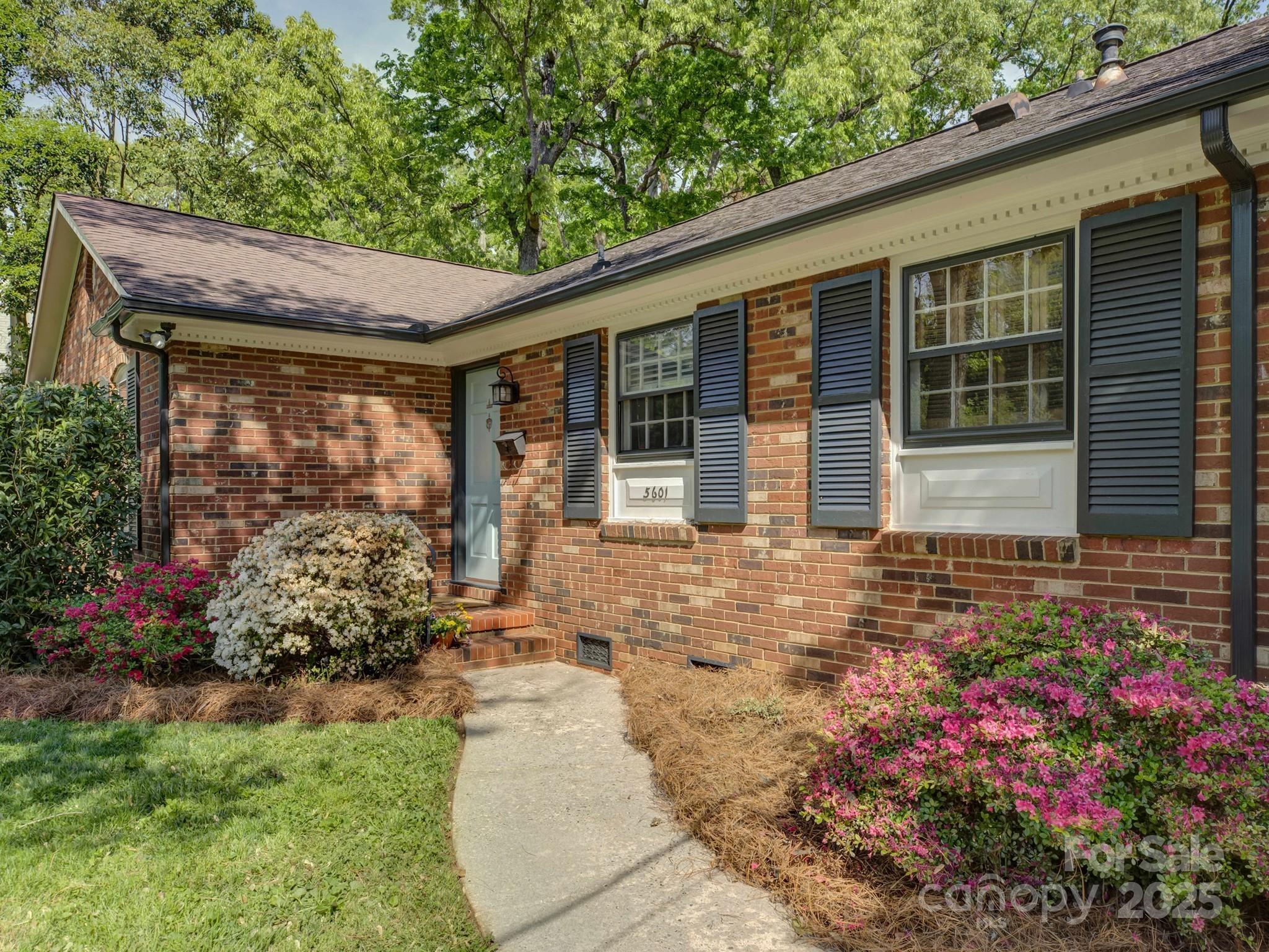 5601 Londonderry Road Charlotte, NC 28210 - Photo 3 of 42 a front view of a house with garden