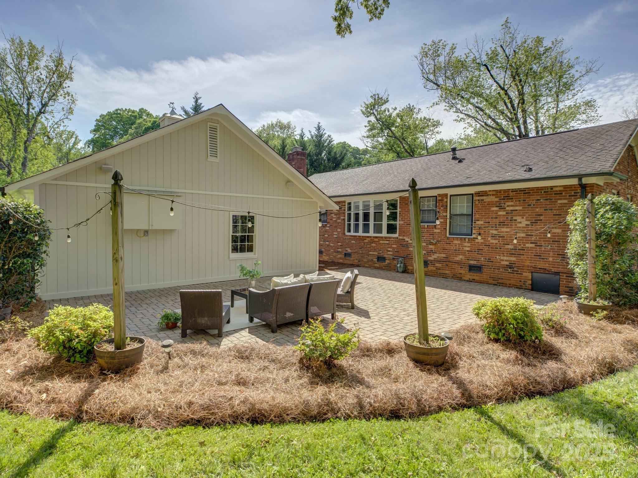 5601 Londonderry Road Charlotte, NC 28210 - Photo 35 of 42 a view of a house with backyard and sitting area