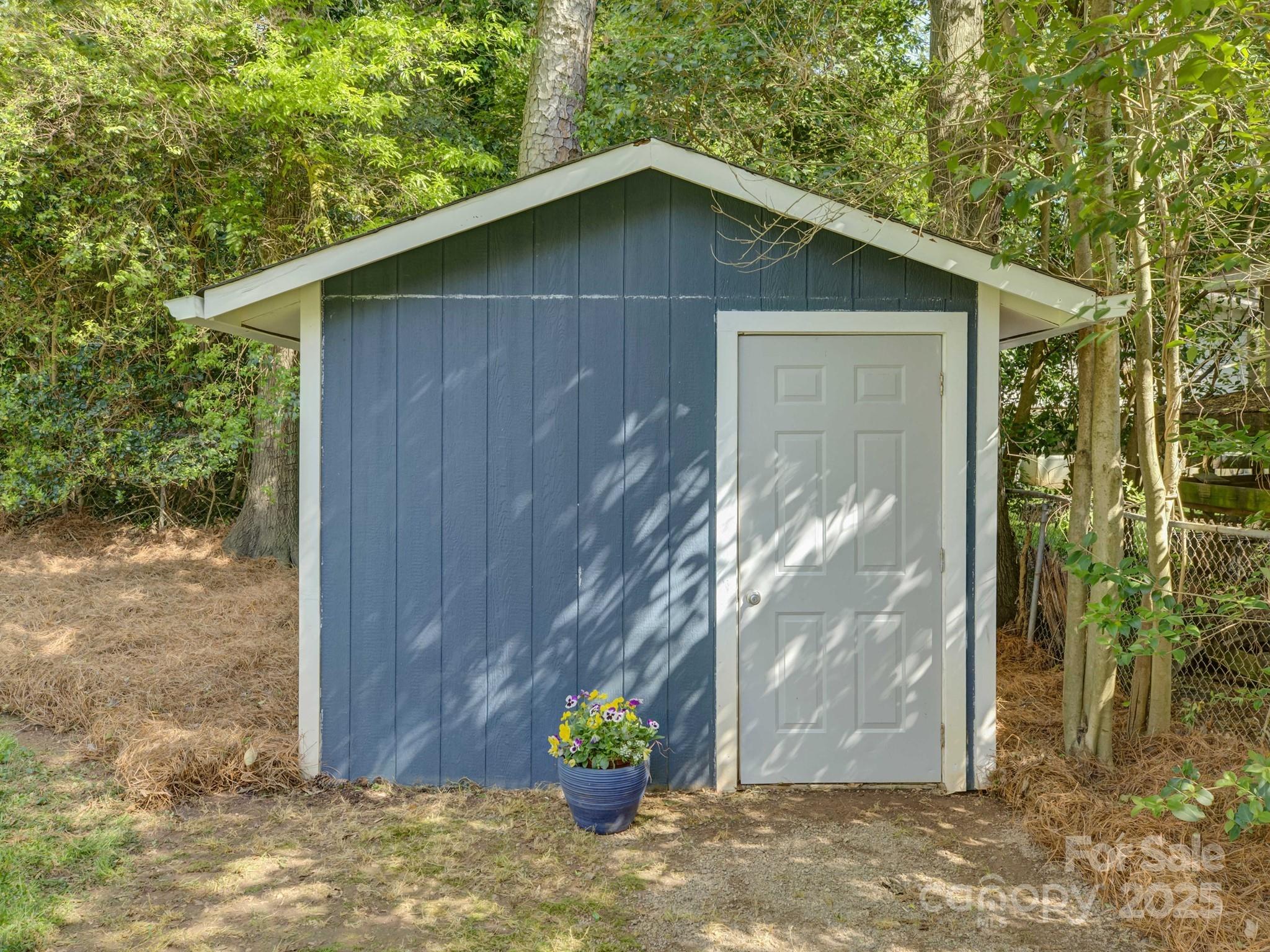 5601 Londonderry Road Charlotte, NC 28210 - Photo 40 of 42 a view of a wooden house with a small yard