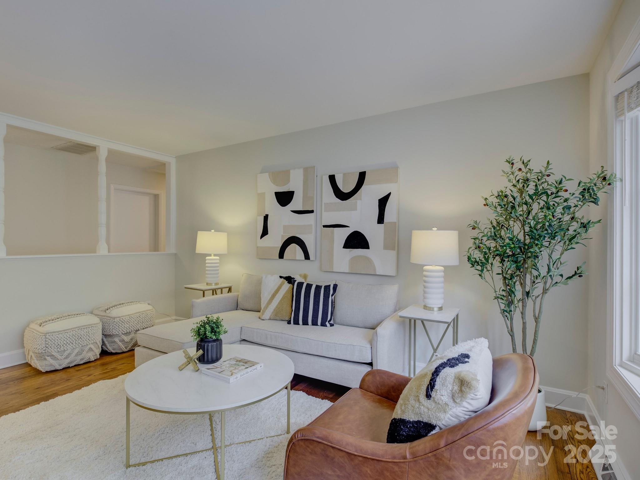 5601 Londonderry Road Charlotte, NC 28210 - Photo 6 of 42 a living room with furniture and a potted plant