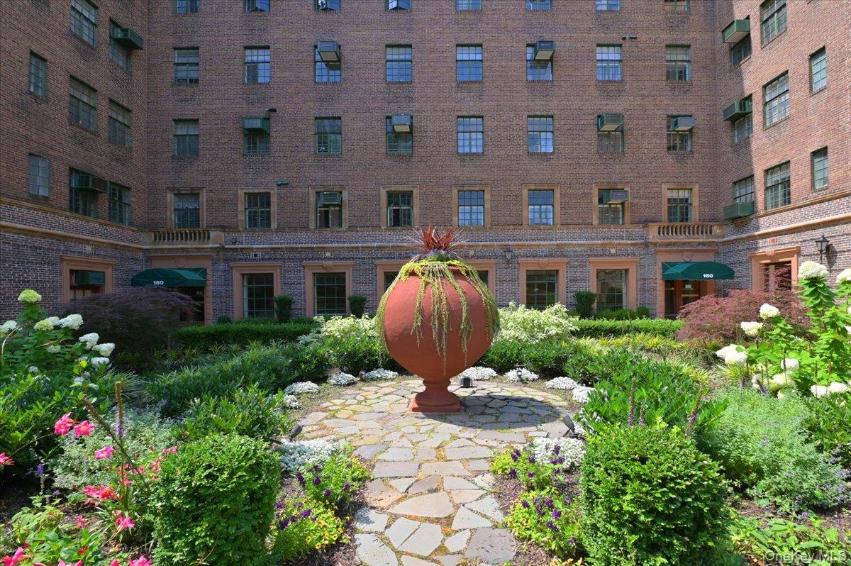 160 Middle Neck Road, Unit 2G Great Neck, NY 11021 - Photo 38 of 41 a view of a building with garden and entertaining space