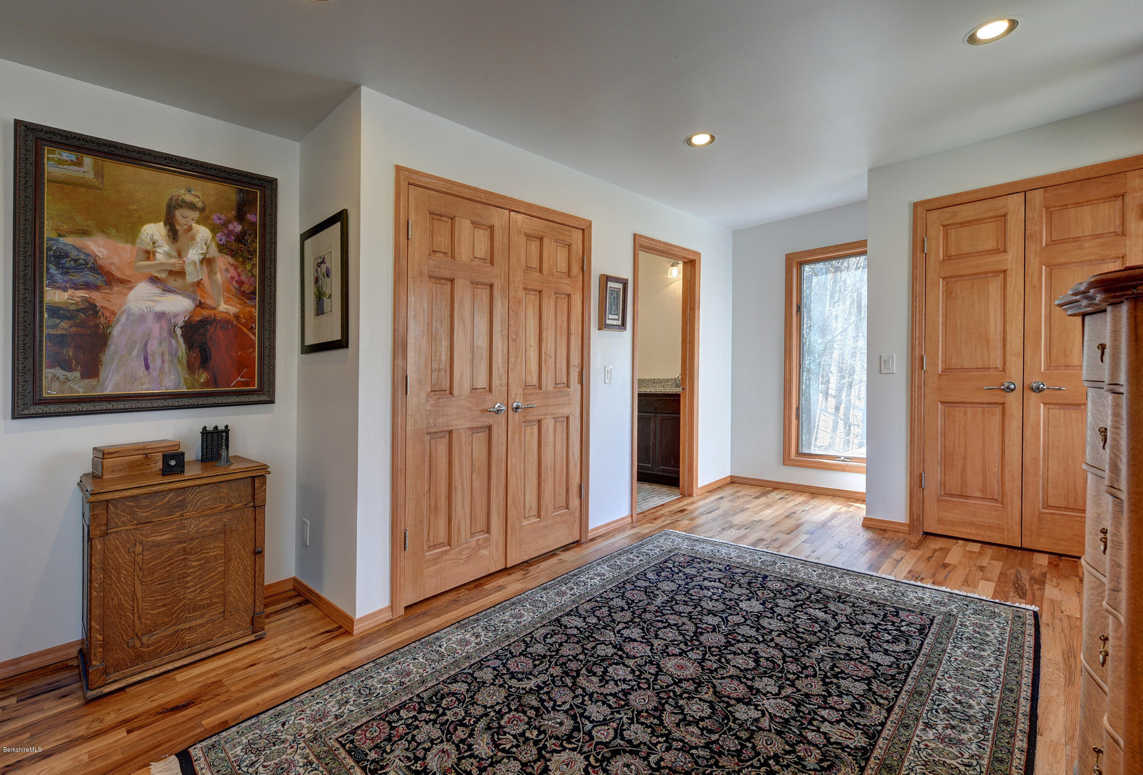218 Whitman Road Hancock, MA 01267 - Photo 22 of 40 a view of a bedroom with wooden floor and cabinet