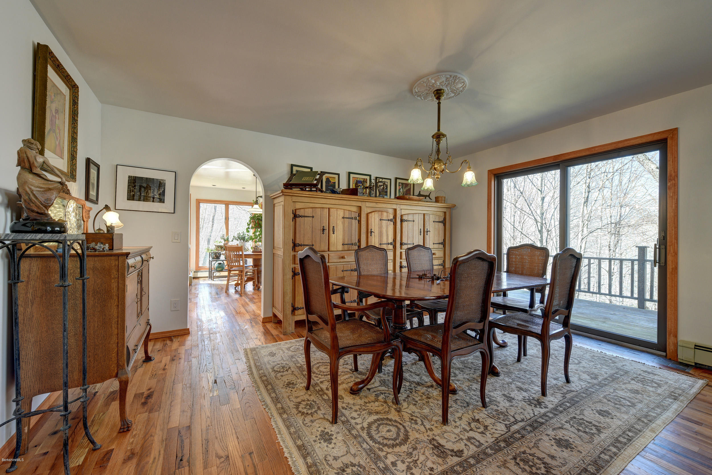 218 Whitman Road Hancock, MA 01267 - Photo 8 of 40 a view of a dining room with furniture window and wooden floor