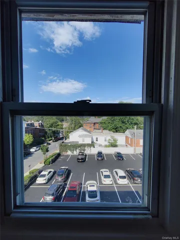 a view of a balcony with wooden floor