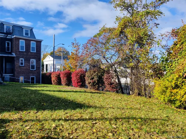 a view of a building with a yard