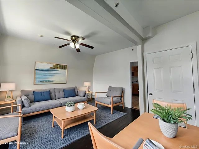 a living room with furniture and a table