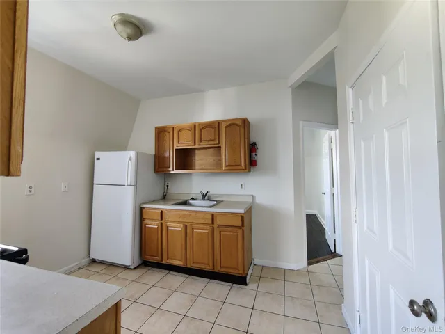 a room with a washing machine and sink