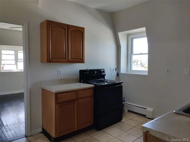 a kitchen with a cabinets and window