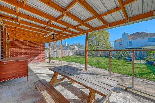 a view of a backyard with sitting area