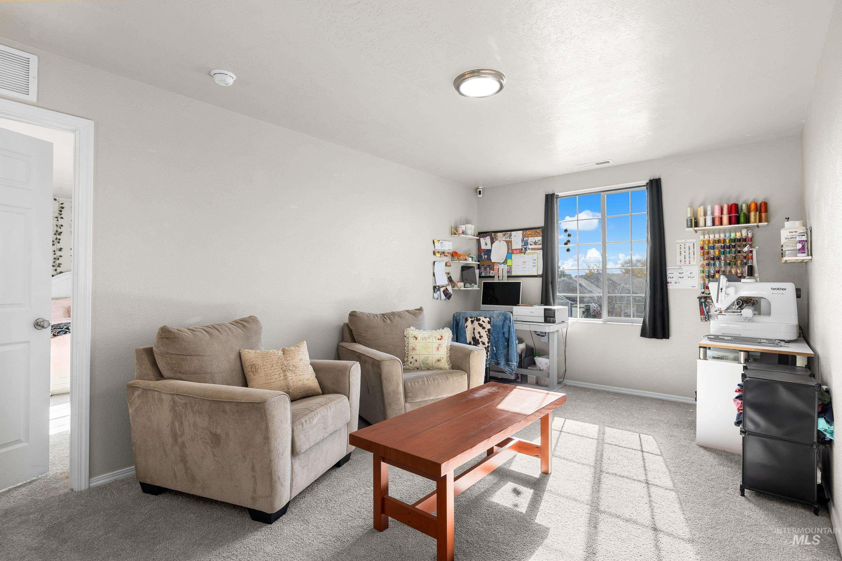 20202 Jennings Way Caldwell, ID 83605 - Photo 16 of 30 Living room with light colored carpet