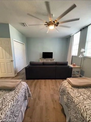 a bedroom with two beds and painted walls