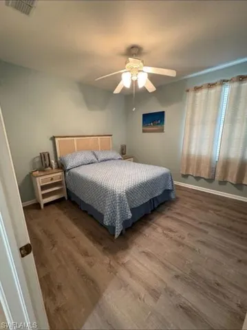 a bedroom with a bed and cabinets