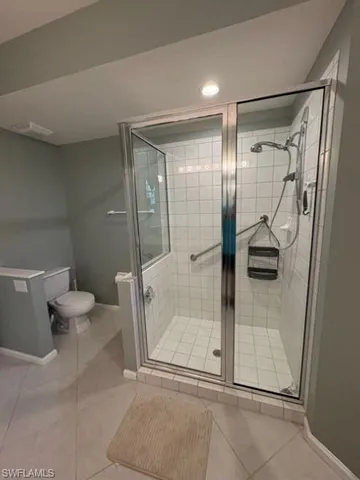 a bathroom with a sink a toilet a mirror and a tub