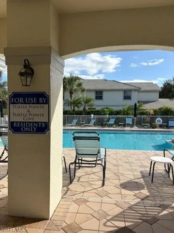 a view of balcony with wooden floor and outdoor seating