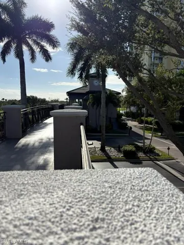 a bedroom with a large bed and a tv on a dresser